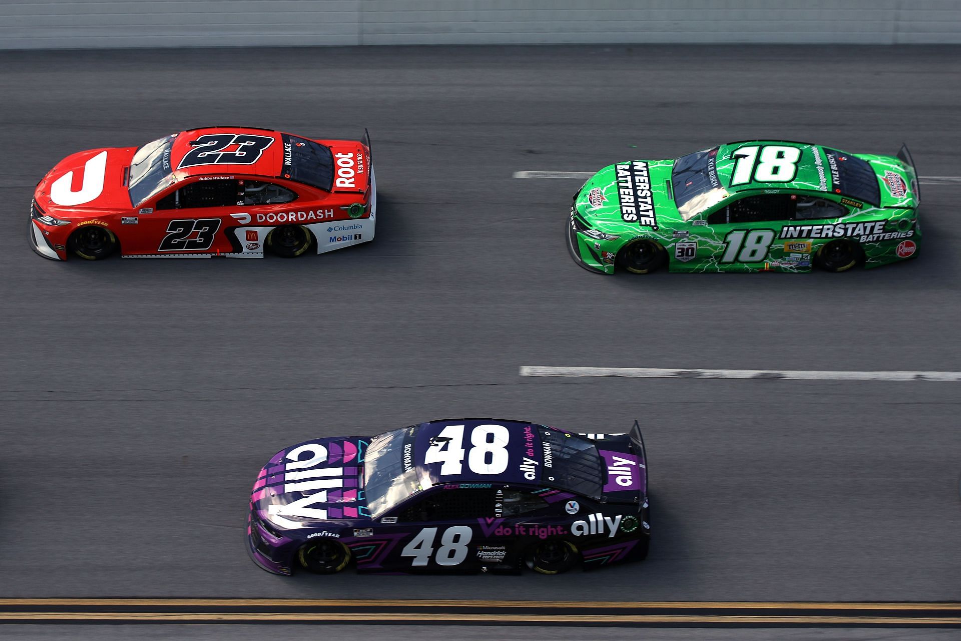 Bubba Wallace (23), Alex Bowman (48), and Kyle Busch (18) during the 2023 GEICO 500. Source: Getty